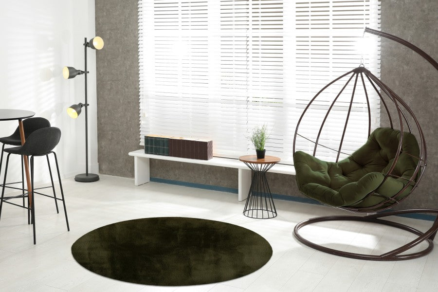 small green round rug in room