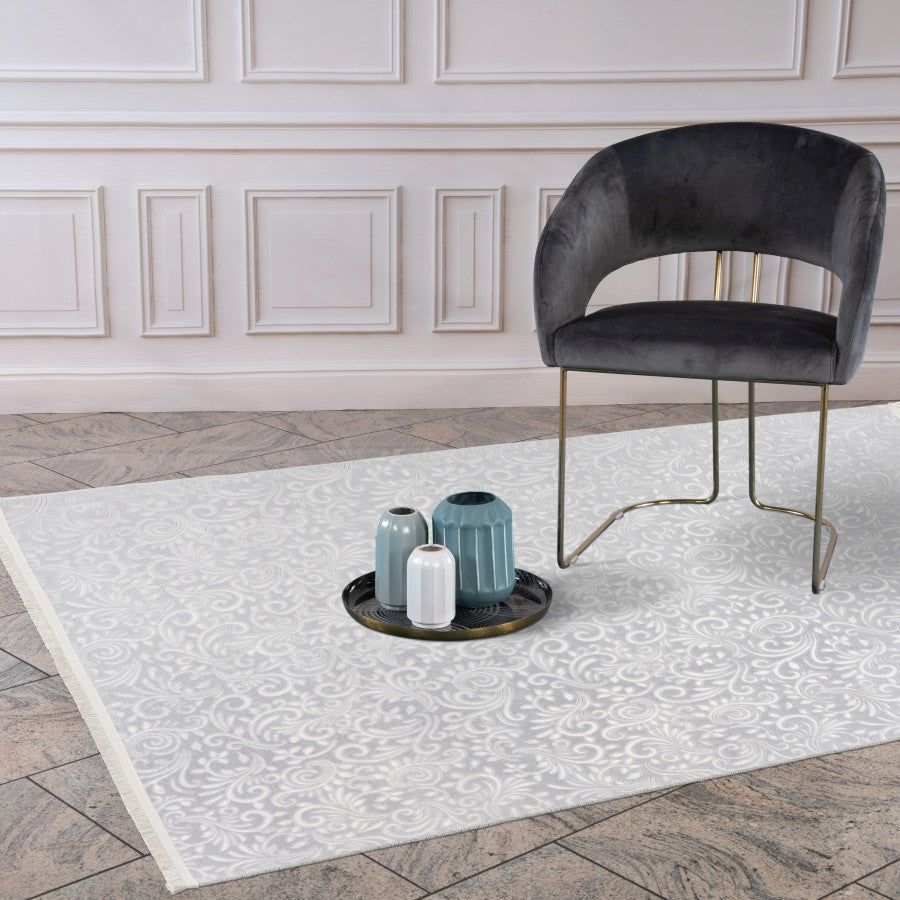 Peri 100 grey floral washable rug styled in a room