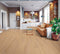 Lounge with a tan leather sofa on a pale pinkish blonde timber floor