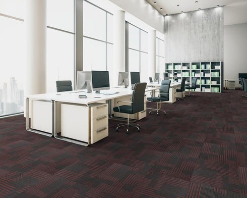 Office floor of black carpet tiles with dark red and burgundy stripes