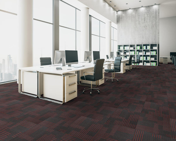 Office floor of black carpet tiles with dark red and burgundy stripes