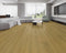Lounge room laid with mid golden honey vinyl plank flooring