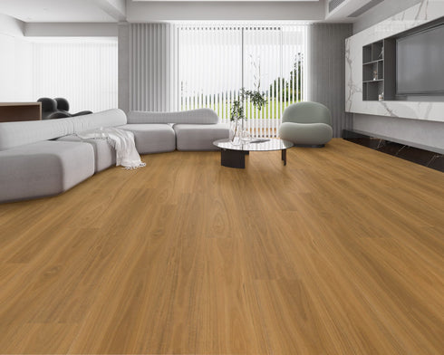 Lounge room laid with warm amber honey vinyl plank flooring
