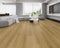 Lounge room laid with light to mid golden oak vinyl plank flooring
