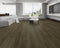 Lounge room laid with dark olive-brown smoked vinyl plank flooring