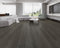 Lounge room laid with dark charcoal grey vinyl plank flooring
