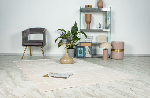 Modern beige area rug featuring symmetrical rectangular pattern with soft white lines