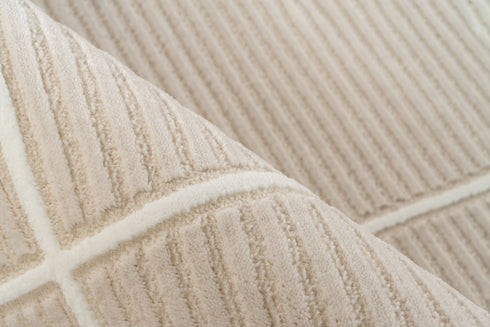 Stylish beige rug showcasing a clean geometric layout of rectangles and subtle textured background