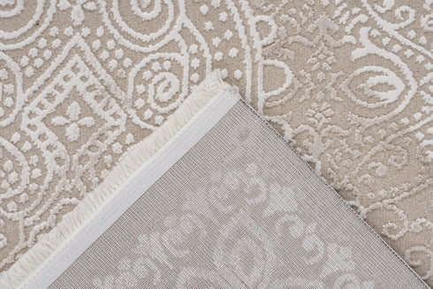 Neutral-toned rug with central medallion and detailed flourishes for living room or bedroom