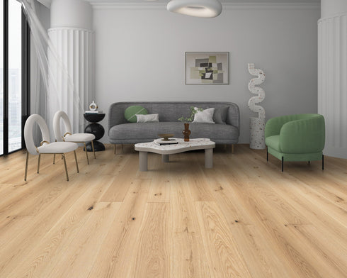 Lounge with a grey sofa and green chair on a pale warm blonde oak floor