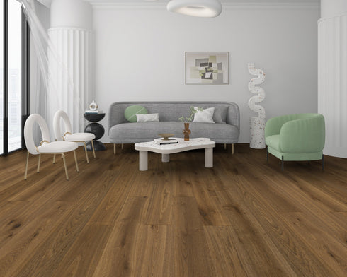 Lounge with a grey sofa and green chair on a warm mid to dark brown oak floor