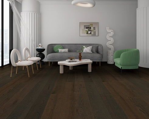 Lounge with a grey sofa and green chair on a very dark espresso brown oak floor