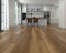 Kitchen with a high contrast laminate floor ranging from honey to chocolate brown