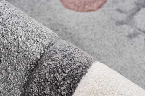 Soft grey rug with playful elephant motif for kids bedrooms