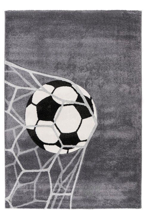Kids rug with soccer ball hitting the net on grey background