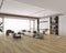 Open-plan lounge with a mid greige-taupe laminate plank floor showing darker streaks