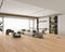 Open-plan lounge with a light pinkish tan laminate plank floor