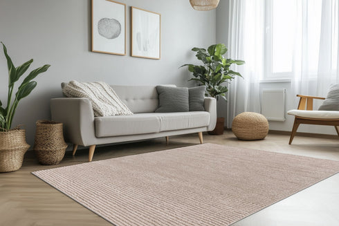 Neutral-toned rug featuring subtle linear pattern and plush surface