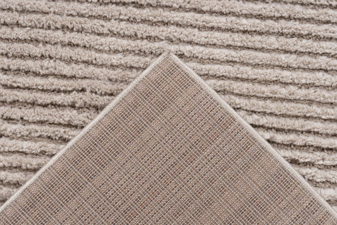 Textured rug in beige with refined stripe detailing