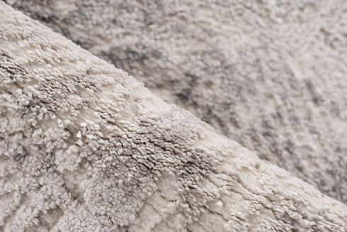 Low pile rug with layered grey tones and vintage-inspired design