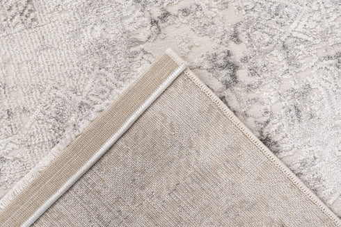 Neutral-toned rug with intricate abstract detailing