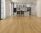Kitchen with a mid golden honey laminate plank floor