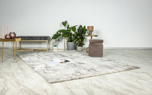 Modern rug featuring layered neutral tones and textured design