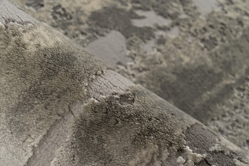 Contemporary low pile rug with artistic weathered surface look