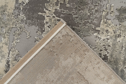 Neutral-toned rug with abstract pattern inspired by natural textures
