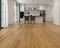 Kitchen with a warm orange-honey tan laminate plank floor