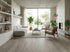 Storm Grey 8mm Stonefloor hybrid flooring in a lounge - Adore Rugs & Flooring