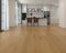 Kitchen with a warm mid honey tan laminate plank floor