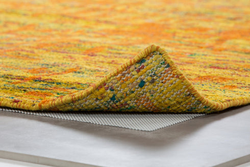 Anti-slip grip underlay laid under a rug, part of the Adore Rug Care Kit