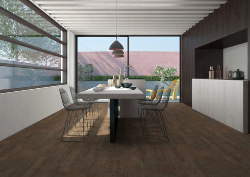 Ornato Como 5.3mm looselay vinyl plank in deep chocolate brown, shown installed in an open plan dining and kitchen space