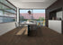 Ornato Como 5.3mm looselay vinyl plank in deep chocolate brown, shown installed in an open plan dining and kitchen space