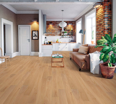 Lounge with a tan leather sofa on a wide honey-tan timber floor with long grain
