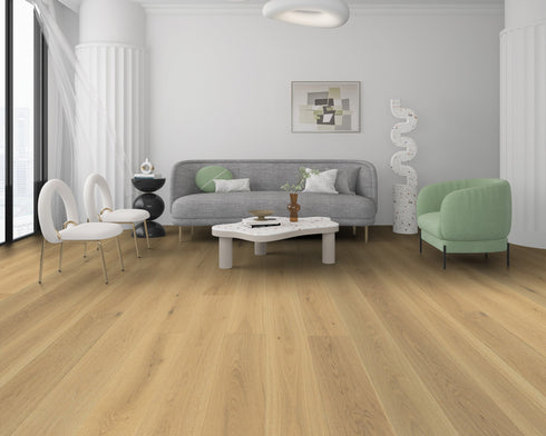 Lounge with a grey sofa and green chair on a light sandy beige oak floor with a honey tone