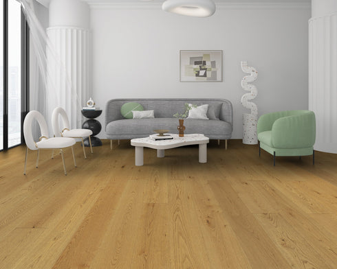 Lounge with a grey sofa and green chair on a mid golden honey-brown oak floor