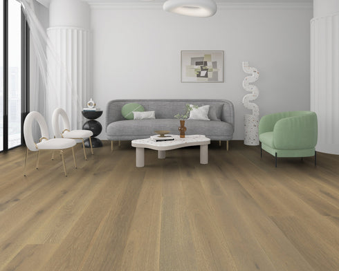 Lounge with a grey sofa and green chair on a muted grey-brown oak floor